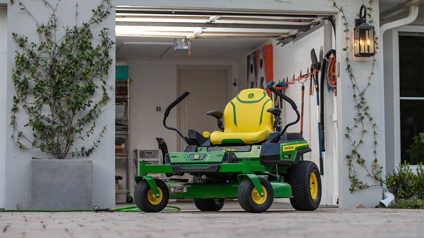 Z370R Electric ZTrak Mower in front of garage