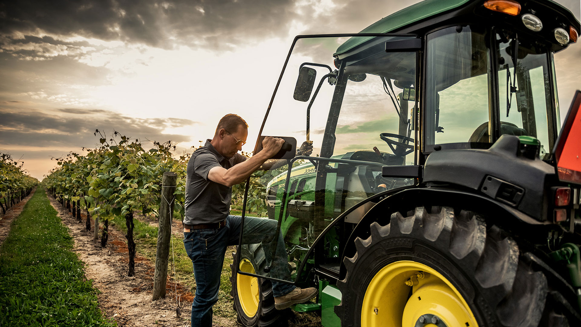 John Deere tractor working in vineyard