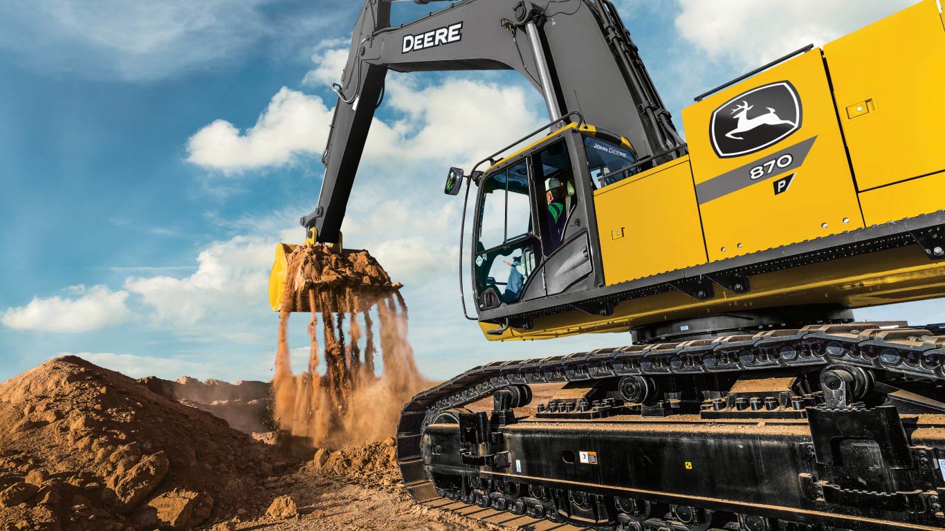 870 P-Tier excavator scooping dirt on the job site