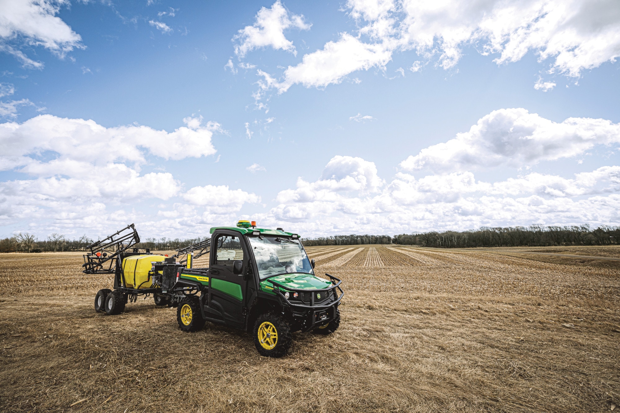 Utility Vehicle and sprayer in field