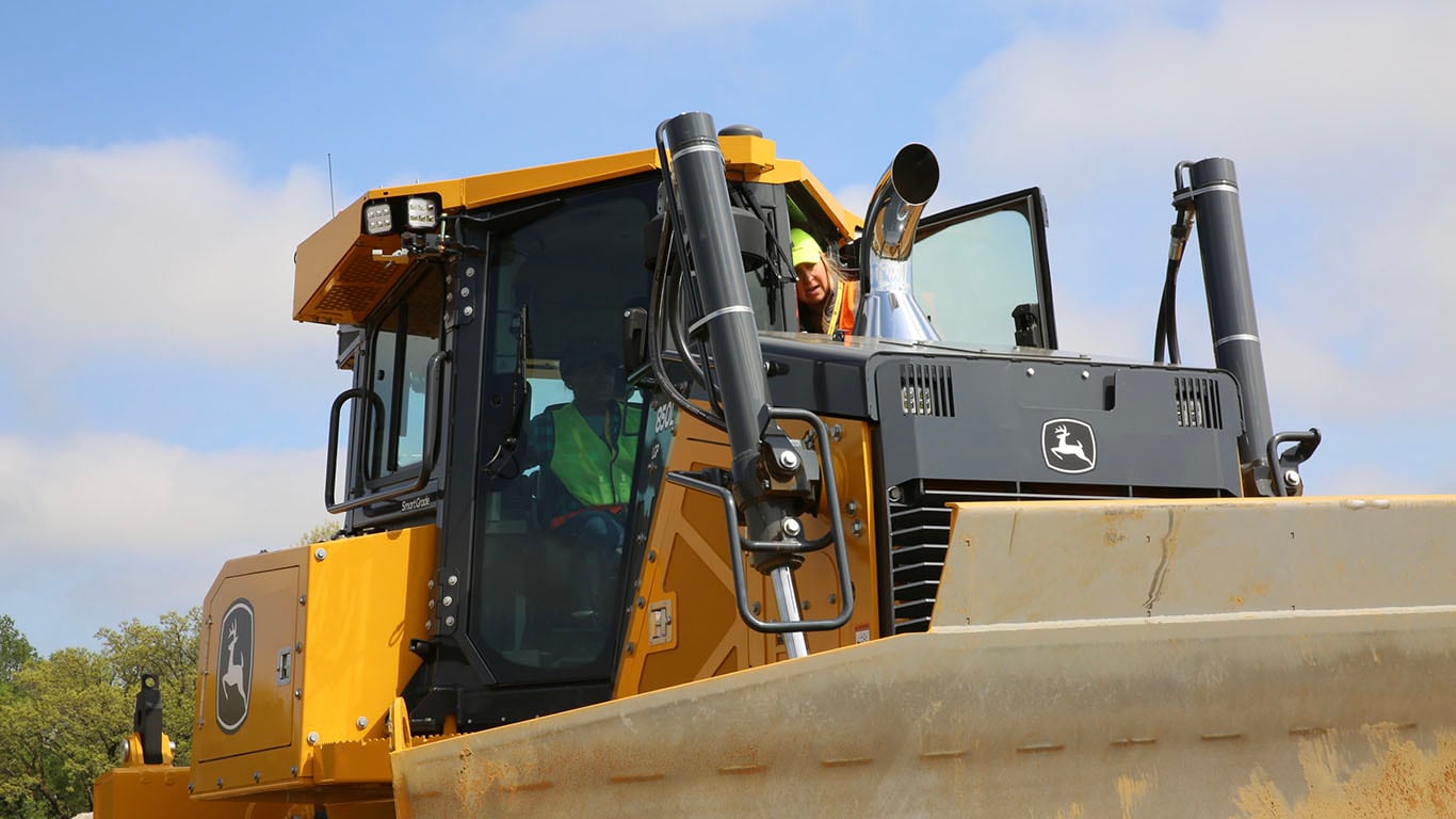 Photo of Jennifer Todd in a John Deere Dozer