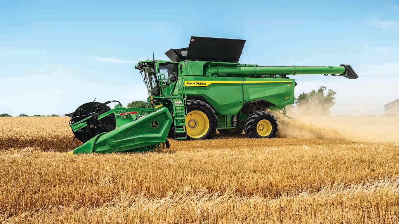 New S7 900 combine with HDF45 draper platform harvesting wheat in the field