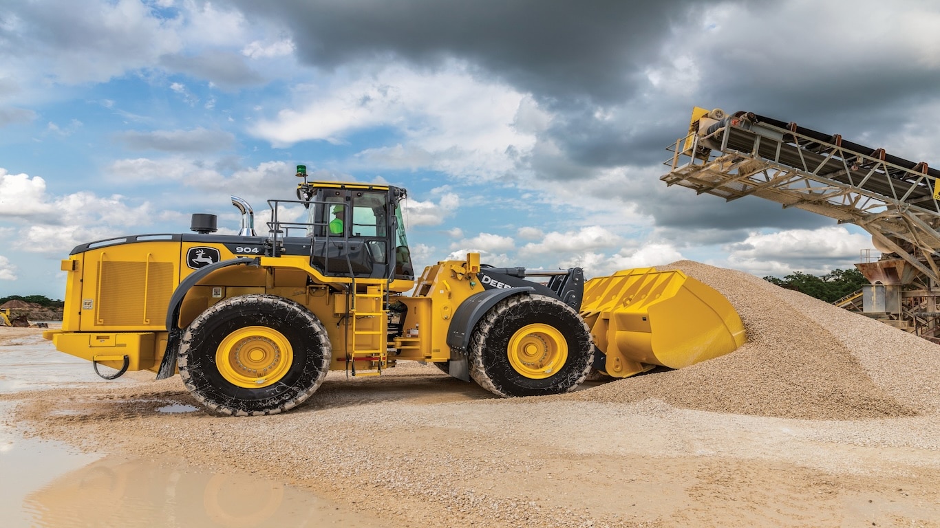 The 904 P-Tier Wheel Loader with transmission assurance scooping dirt
