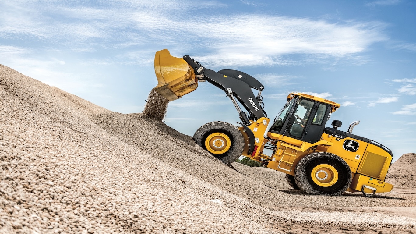 The 644 P-Tier Wheel Loader dumping dirt and using the new John&nbsp;Deere Operations Center features.
