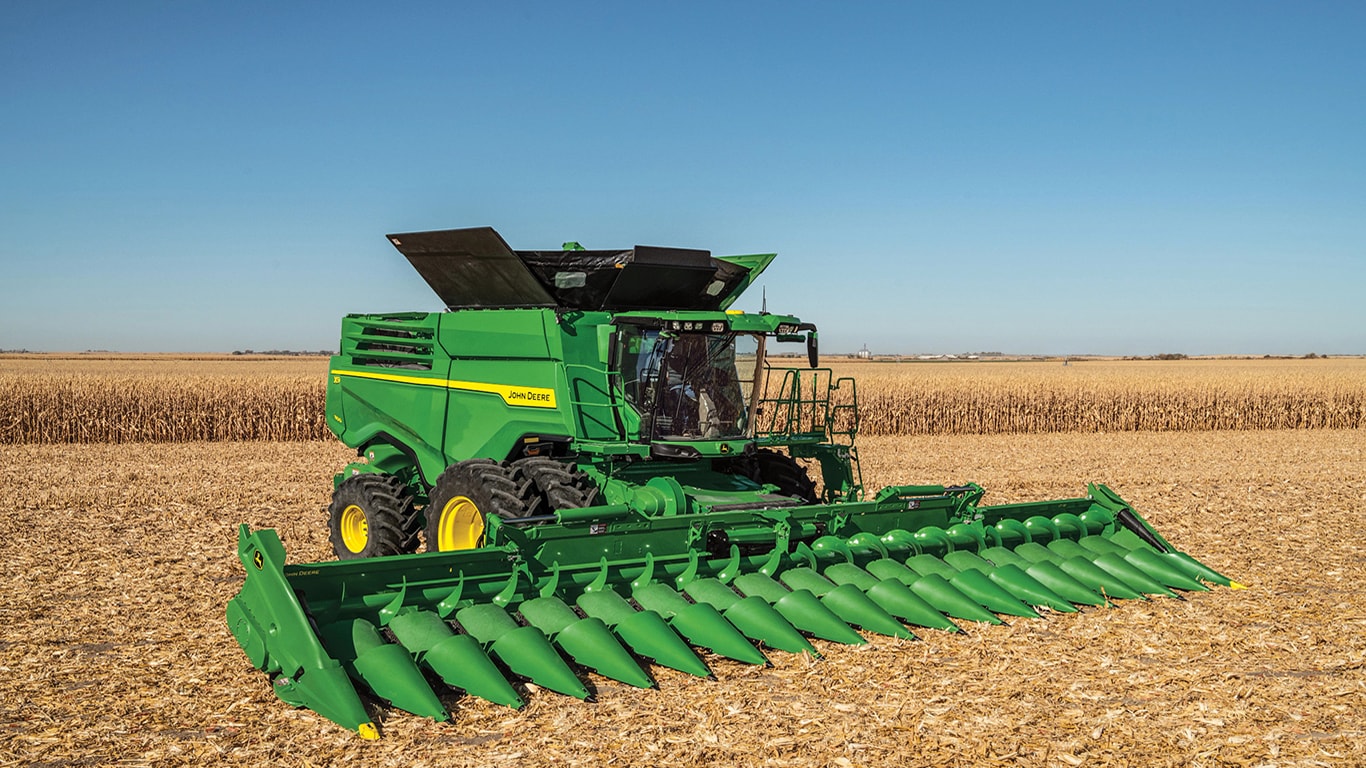 X9 combine with new CF18 corn head parked in the field.