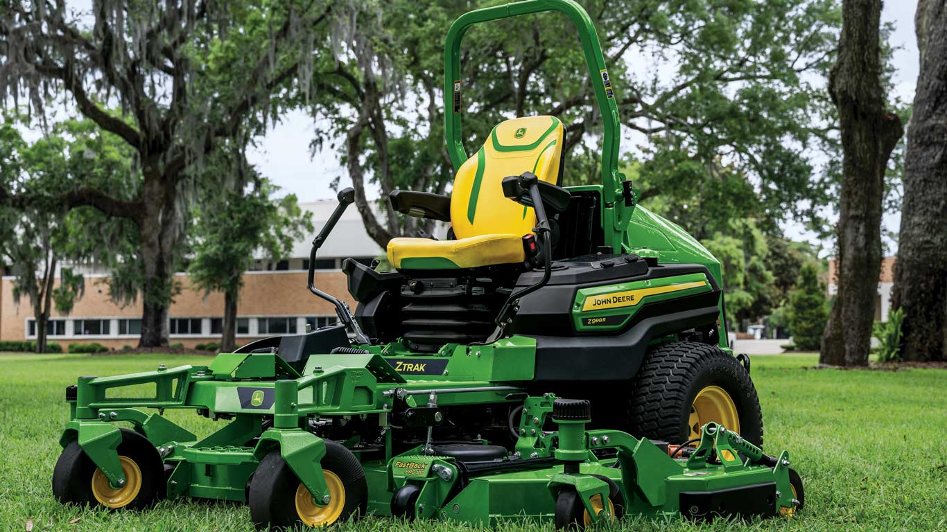John Deere Z998R ZTrak in a grassy area with trees