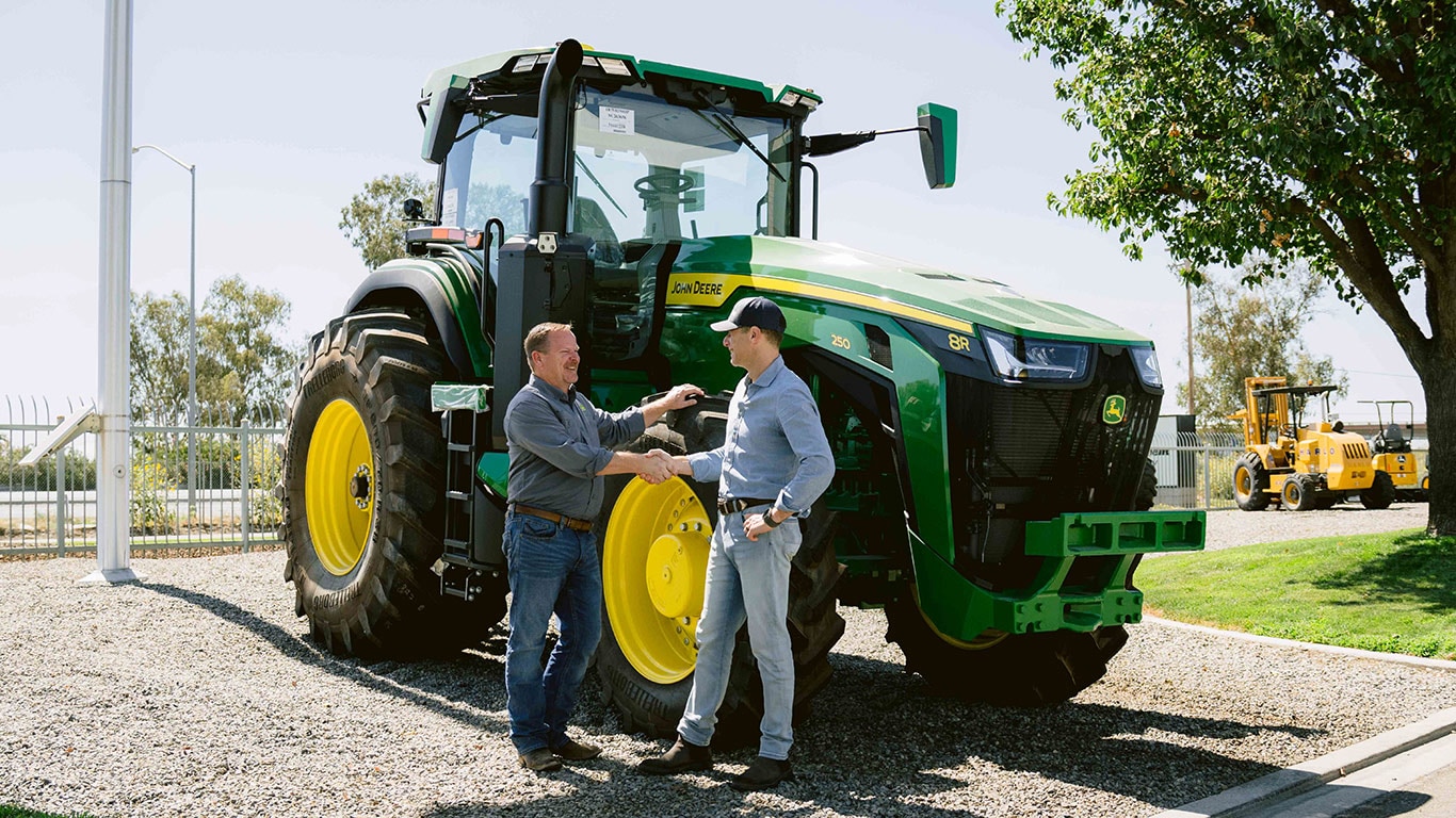 Danny Bernstein, CEO of the Reservoir shakes hands with John Deere business integration manager, Sean Sundberg, to celebrate the start of a strategic collaboration as both company's look to accelerate high-value crop innovation.