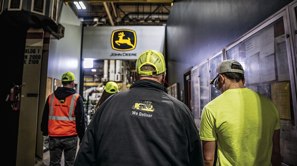 factory workers walk into work