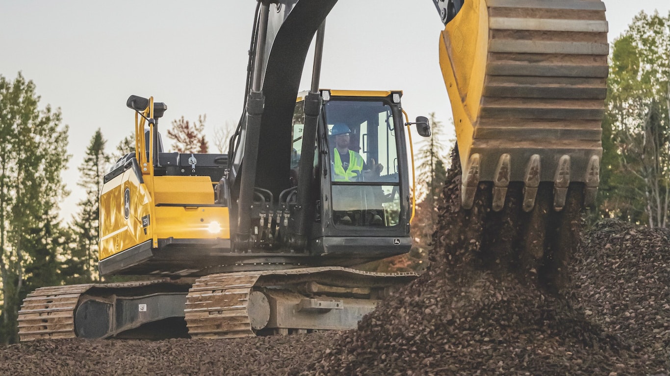230 P-Tier excavator dumping dirt out of the bucket