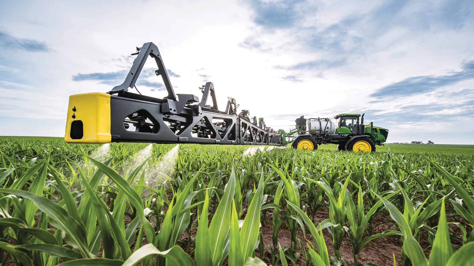 Image of Self-propelled sprayer in field of corn spraying