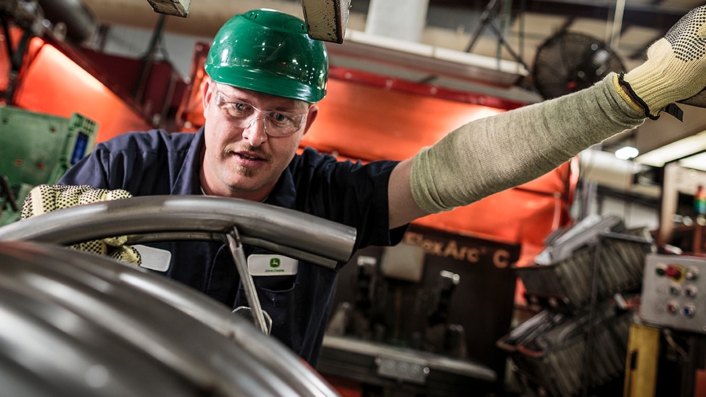 Press Operator running press at John Deere Horicon plant