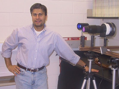 Man next to optical measuring system
