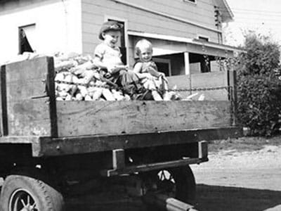 Children in the bed of a truck