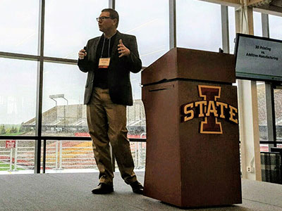 Man standing by a podium