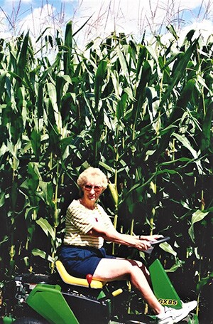 Donna Mack on her John Deere riding lawn mower
