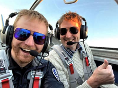 Redden and friend in a plane