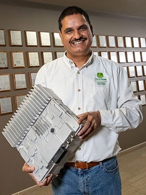 Singh holding an inverter