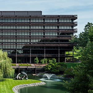 Exterior photo of the John Deere World Headquarters building overlooking the pond and fountains in Moline, Illinois, United States