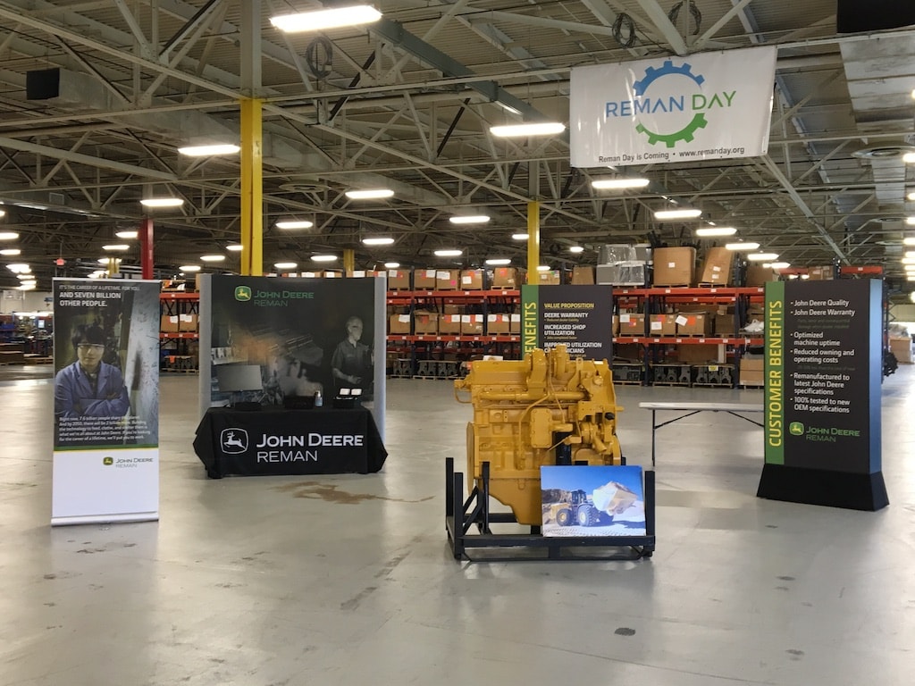 John Deere banner displays on a factory floor
