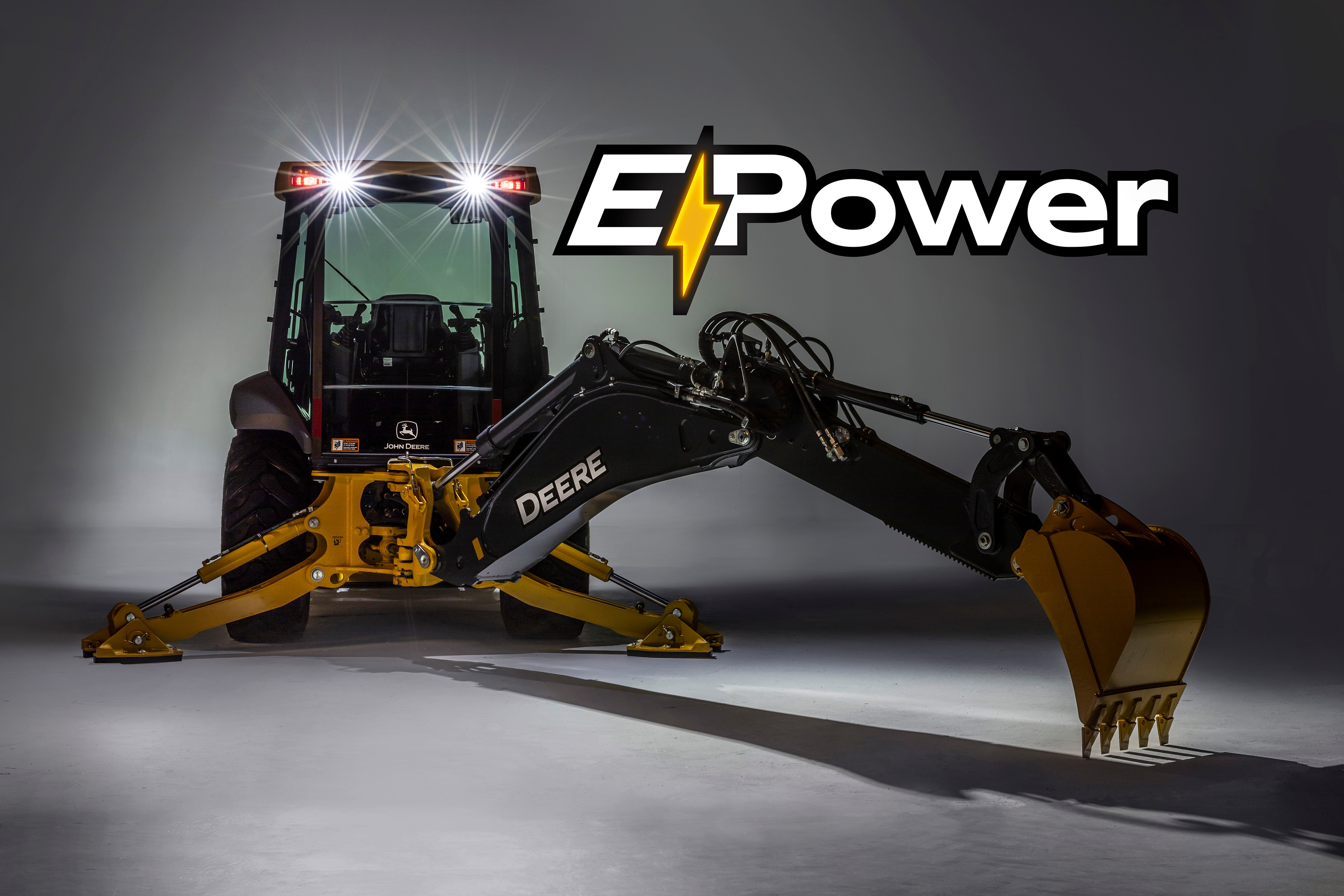 Large studio shot of the electric backhoe with E-Power graphic
