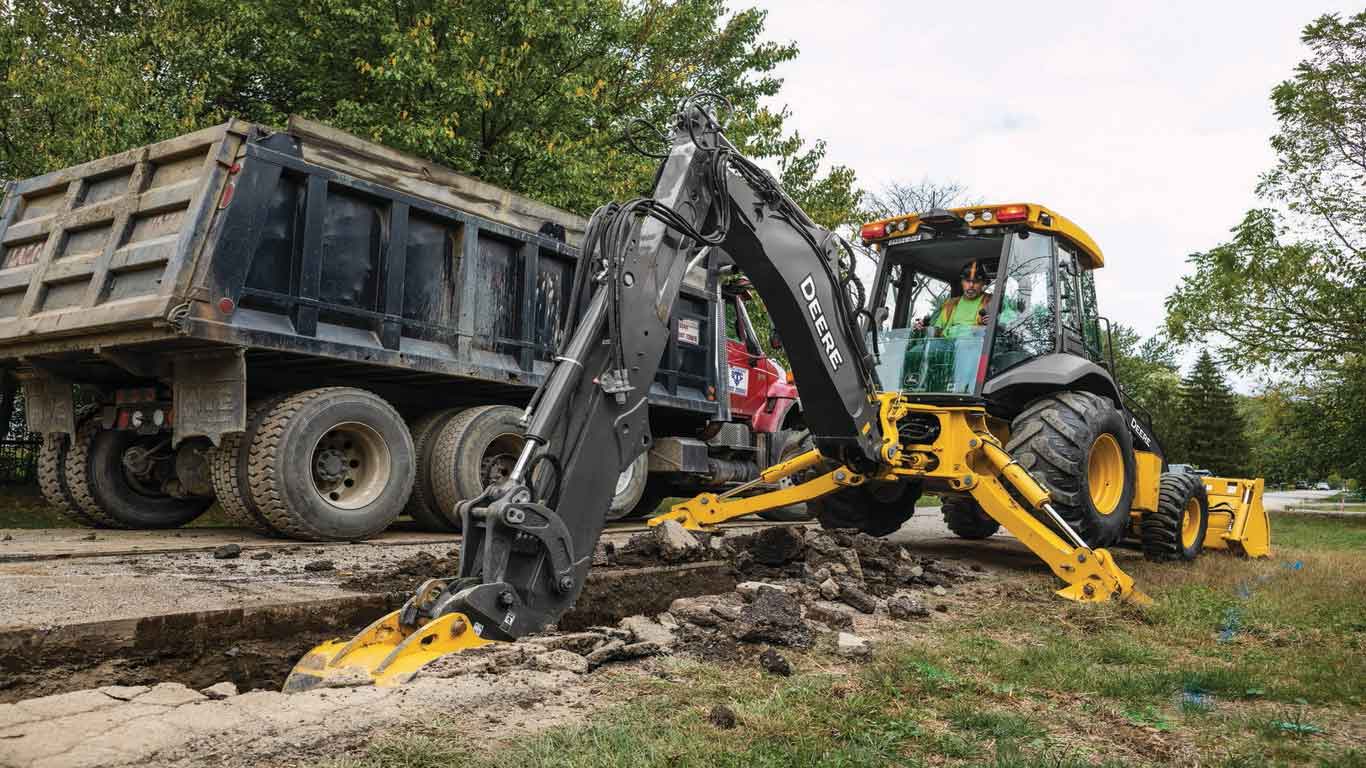 Large image of L-Series Backhoe digging on a jobsite