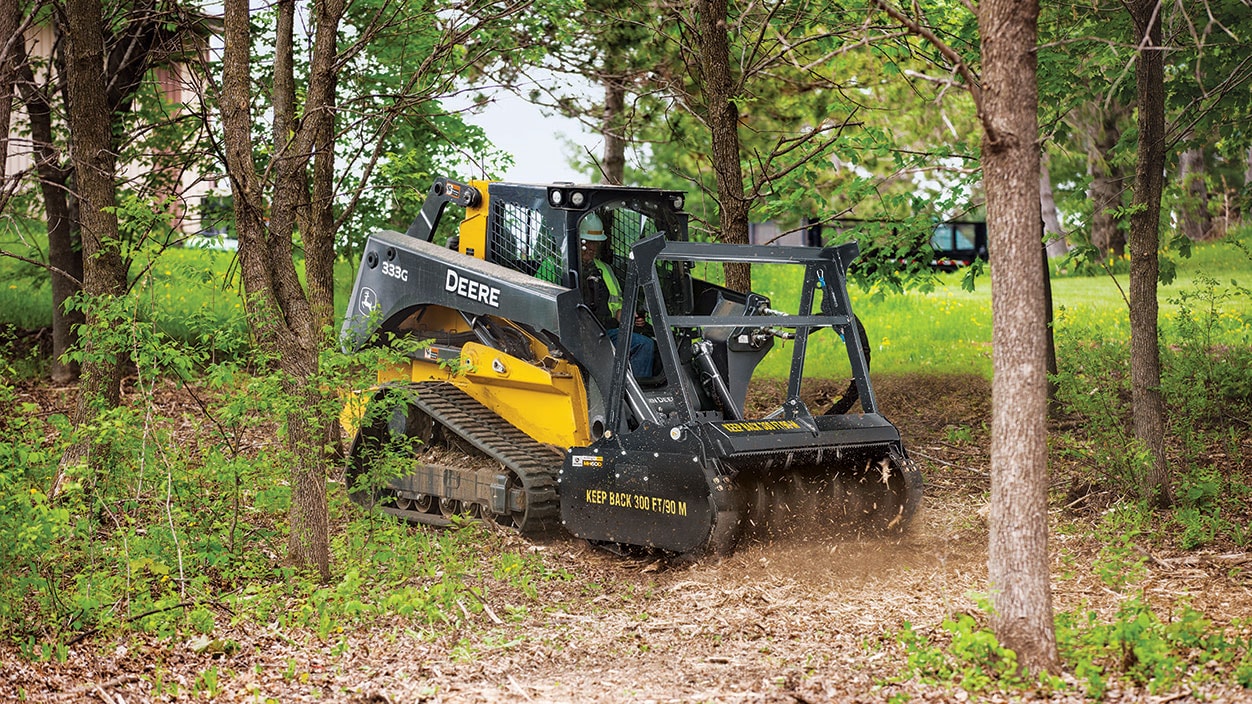 The John Deere MH60D mulching head for skid steers and compact track loaders shreds wood and difficult stumps into mulch quickly.