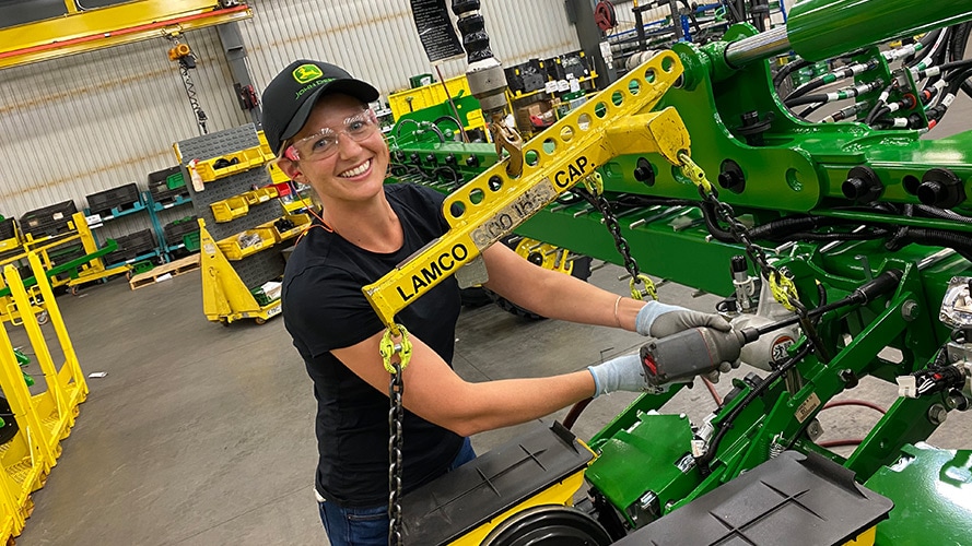 Claire Wilson, a veteran working on building John Deere equipment thanks to the partnership program.