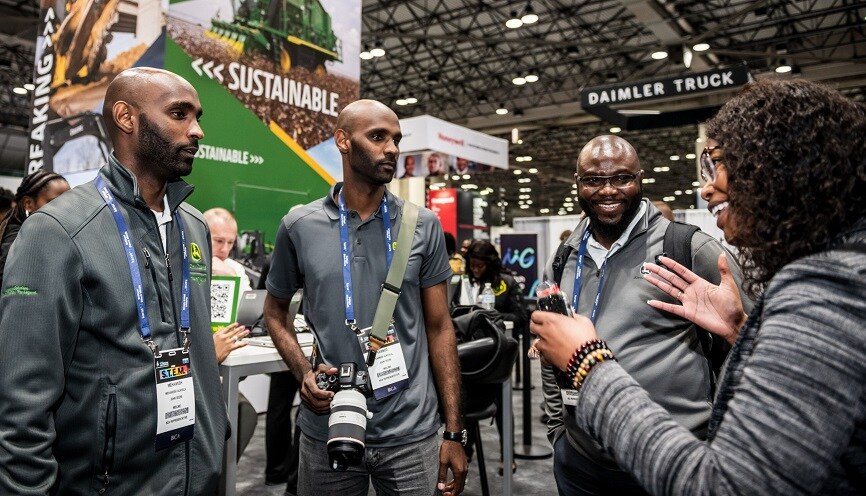 Mehawesh Alkhalil, Kabbodd Alkhalil, Setordji Abotski and Ceena Beall at the National Society of Black Engineers John Deere booth