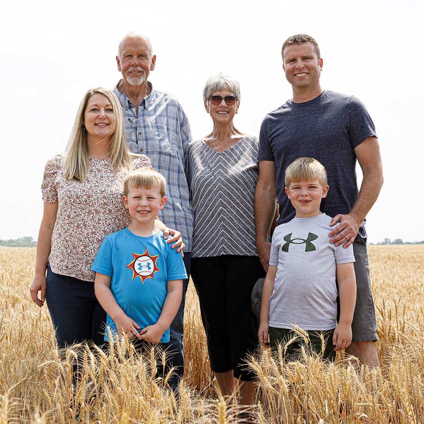 The Pifer family stands in their field of wheat, nearly ready for harvest