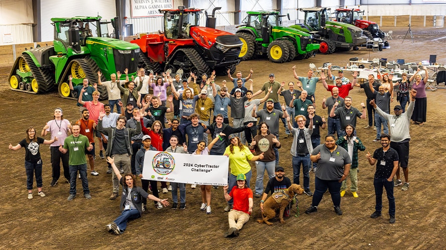 CyberTractor Challenge participants enthusiastically posing in a group photo