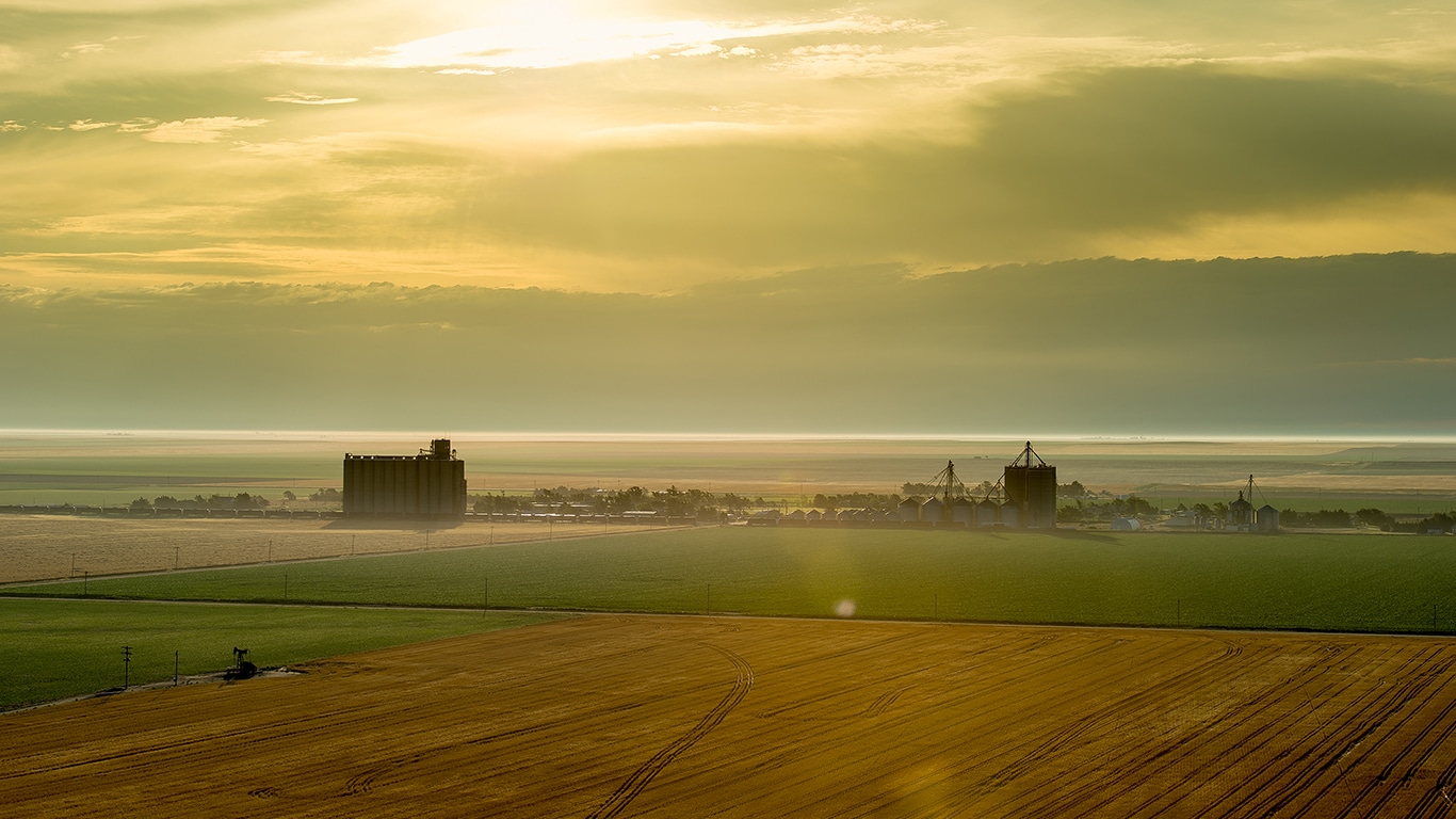 Elevated view of grain farm surrounded by fields.