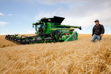 X9 combine in wheat field