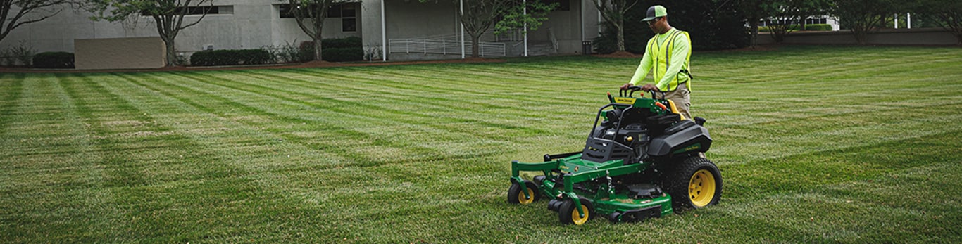 A man mowing with a QuikTrak mower