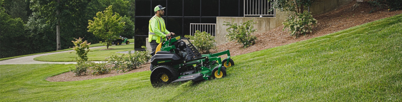 A man mowing with a QuikTrak mower