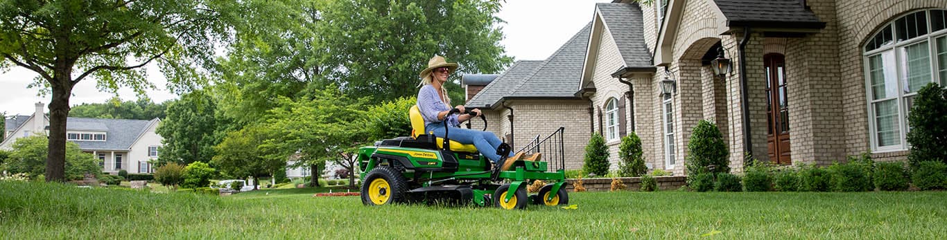 Woman mowing lawn on Z300