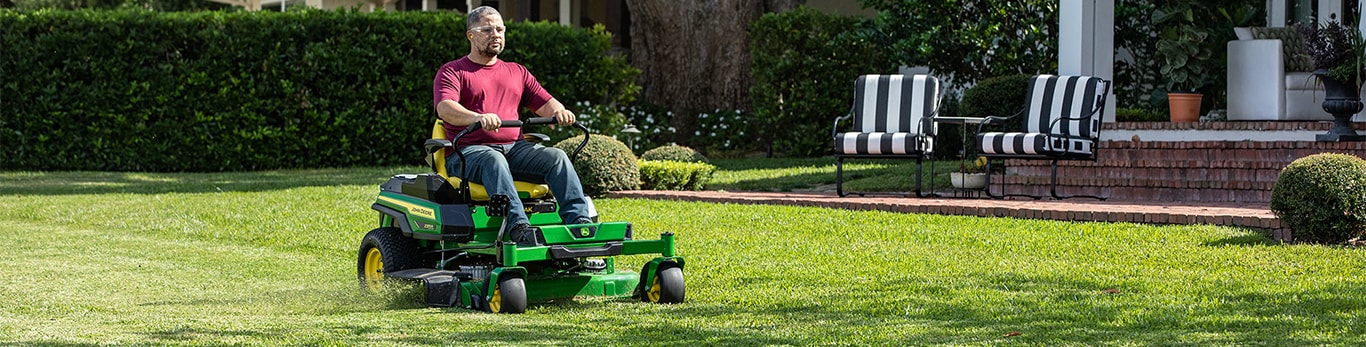 man cutting residential lawn with Z370R Electric ZTrak Mower