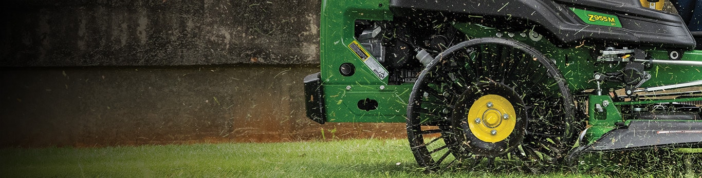 Closeup of mower cutting grass