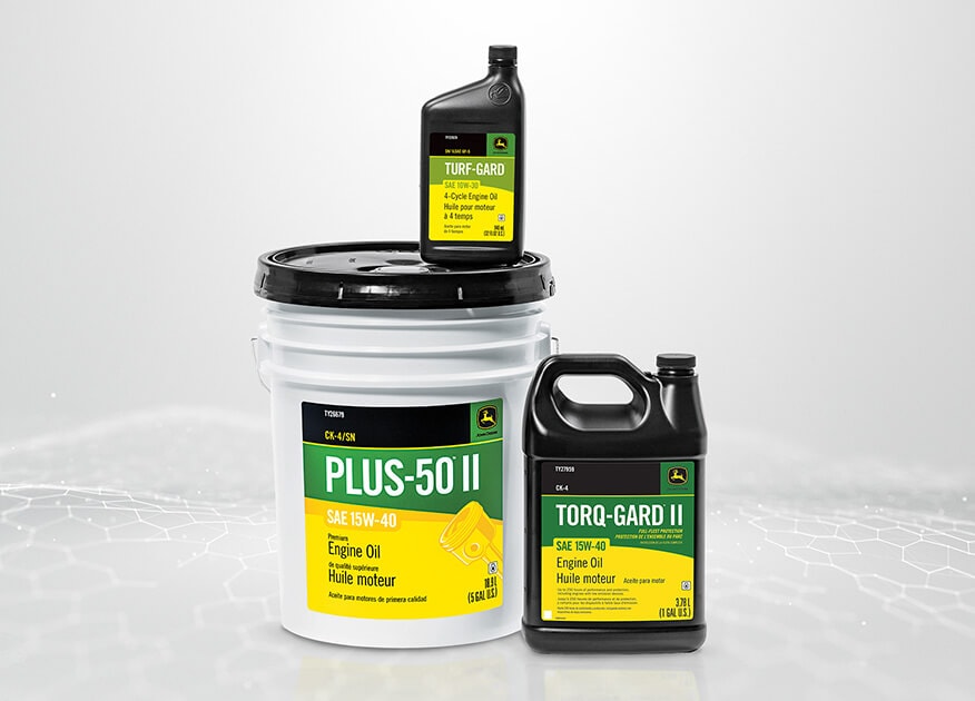 Three containers of John&nbsp;Deere Plus-50 II Premium Engine Oil, Torq-Gard II Engine Oil, and Turf-Gard 4-Cycle Engine Oil on a pale gray background.