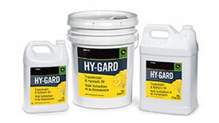 Three containers of John Deere Hy-Gard Transmission & Hydraulic Oil in different sizes on a white background.
