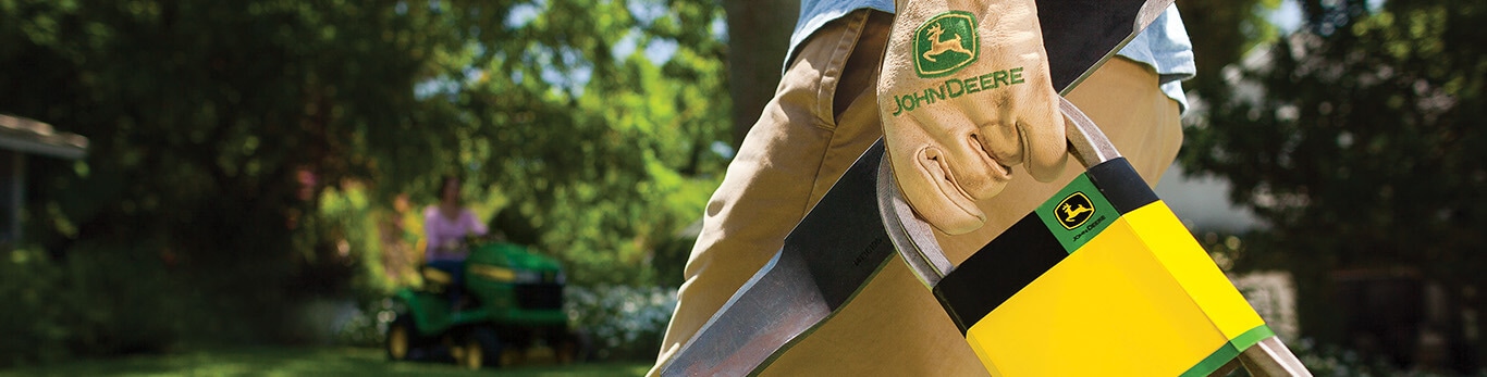 Person walking with John Deere Parts