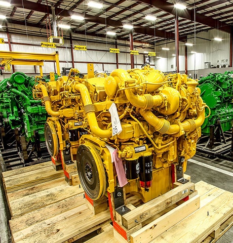 A smiling John&nbsp;Deere Reman machine