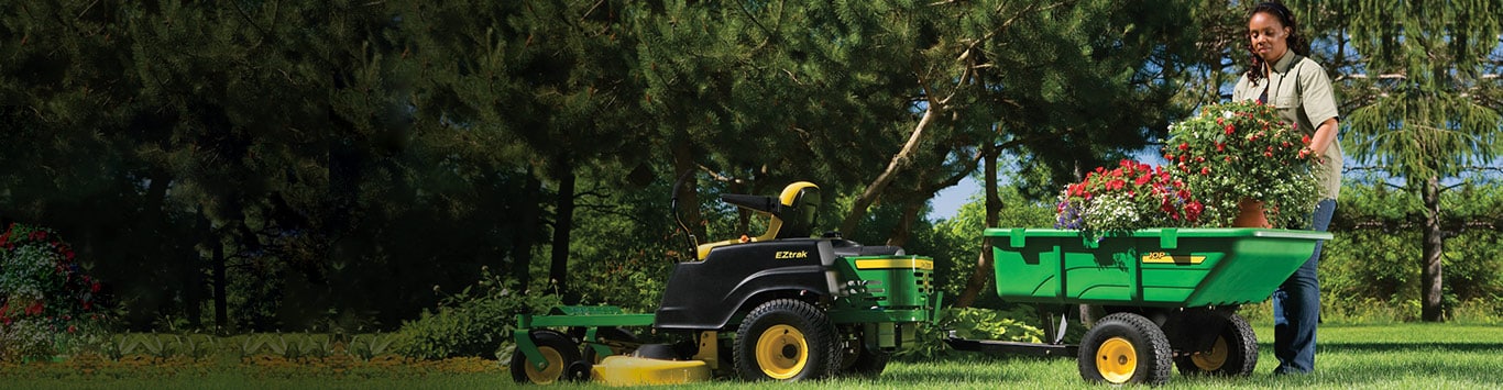 A woman putting flowers in an EZTrak attachment