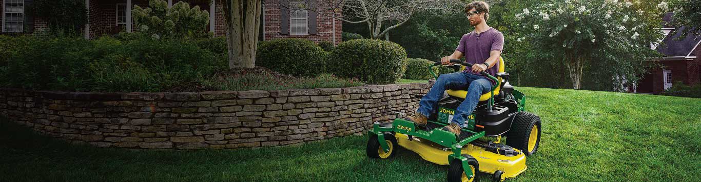 A man mowing his lawn with a Z365R mower