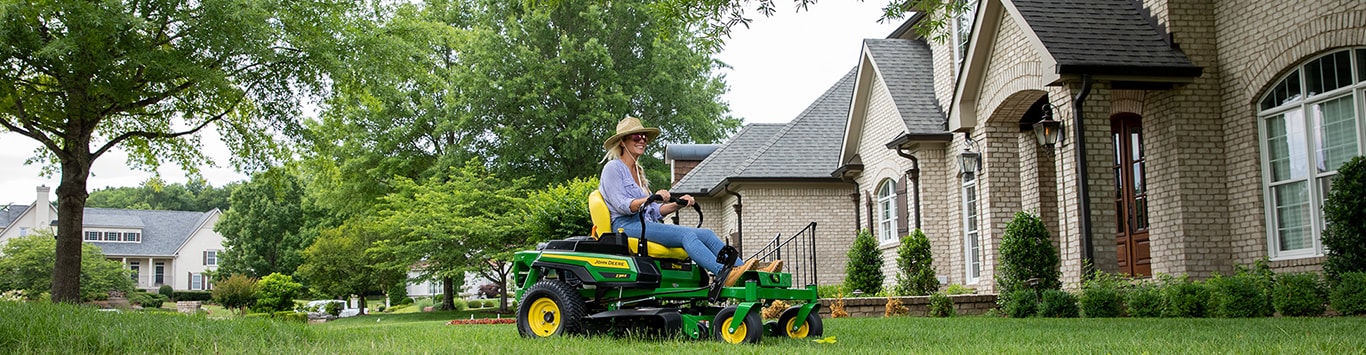 Woman mowing lawn on Z300