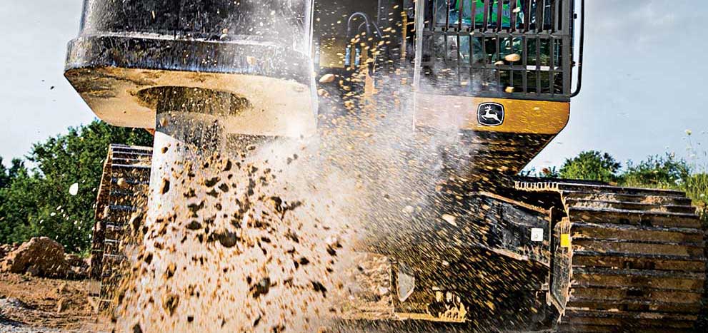 Excavator HH125 with a hammer attachment working at breaking up material.