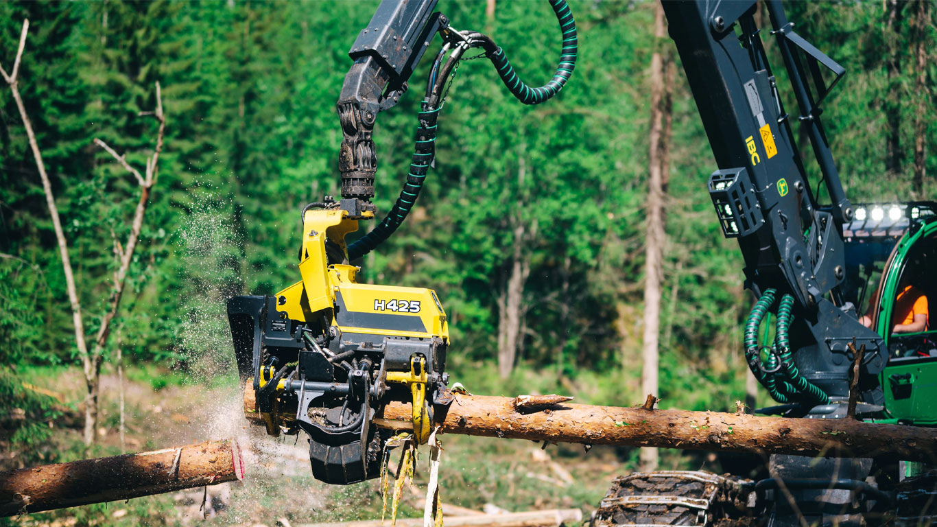 John Deere H425 harvester head attachment at work on landing