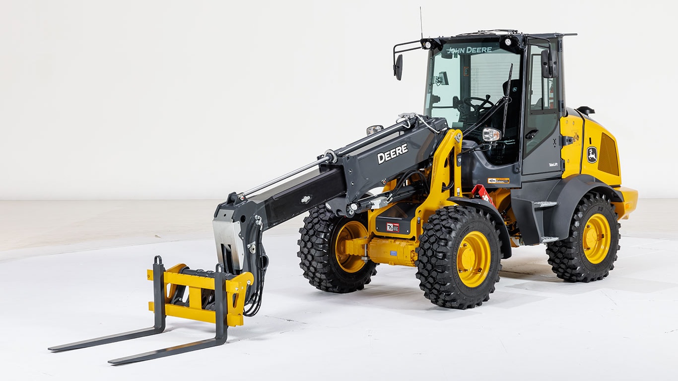 Studio image of a new John Deere 326 P-tier Telescopic Compact Wheel Loader with a fork