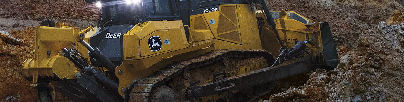 1050K Dozer pushes a dirt on a worksite