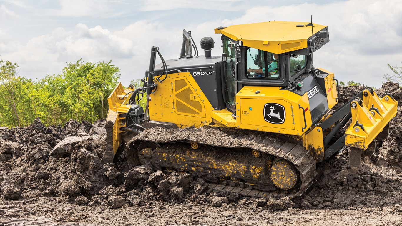 850 P-Tier dozer pushes dirt on a slope