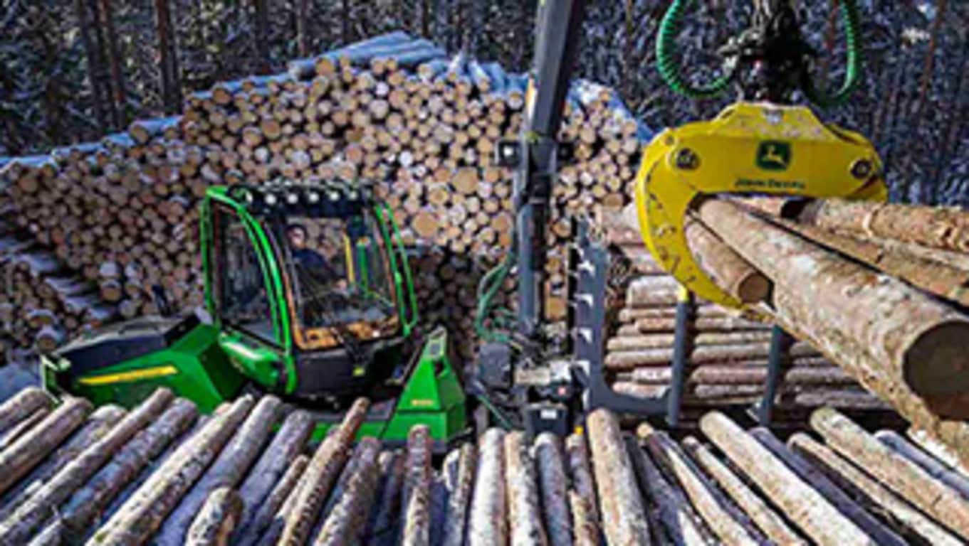 910G 14.0-metric ton forwarder working in the forest